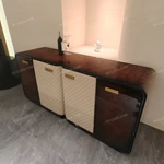 Curved Four-Door Sideboard with Quilted Upholstered Panels High-Gloss Burl Wood Veneer and Gold-Finish Metal Handles